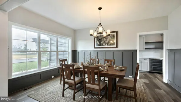 a view of a dining room with furniture window and wooden floor