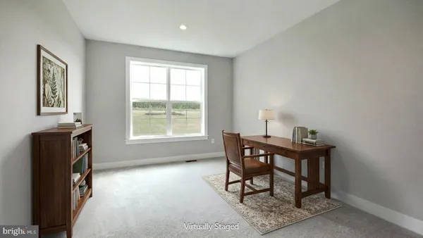 a workspace with furniture and window