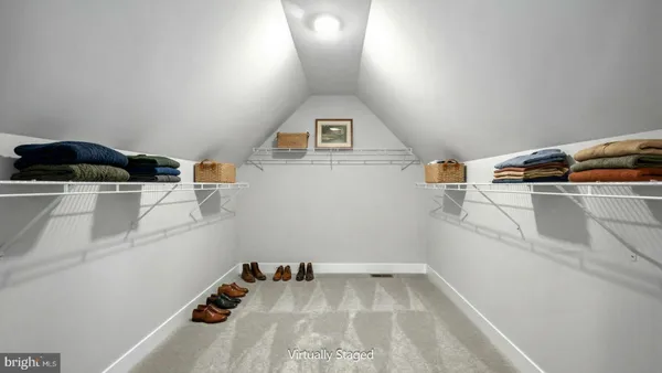 a view of storage and utility room with washer and dryer