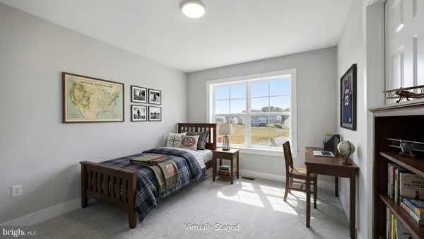 a bedroom with furniture and a window