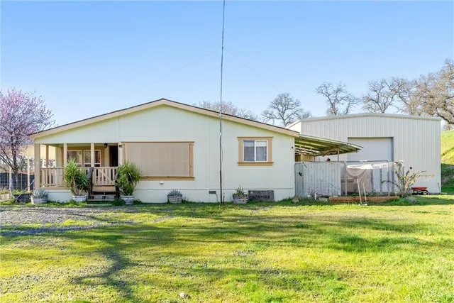 a front view of house with yard having outdoor seating