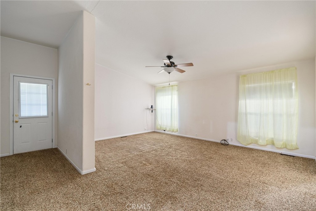 193 Railbridge Road Oroville, CA 95966 - Photo 15 of 32 an empty room with chandelier fan and windows