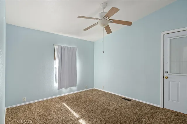a view of a ceiling fan in a room