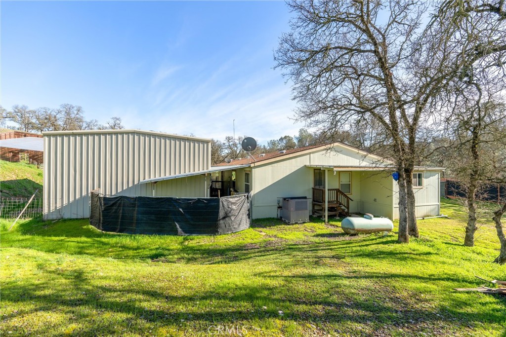 193 Railbridge Road Oroville, CA 95966 - Photo 25 of 32 a view of a house with a yard