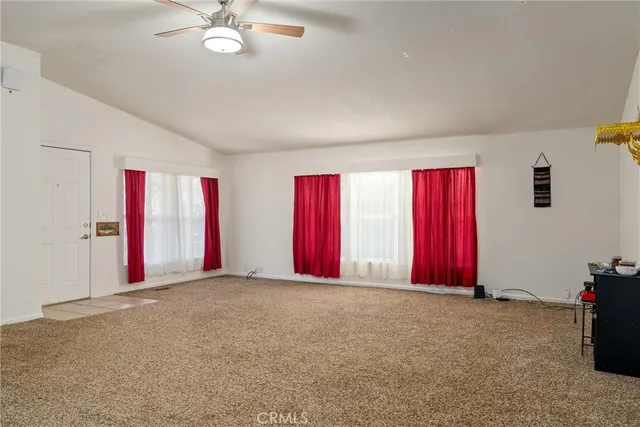 a view of empty room with windows