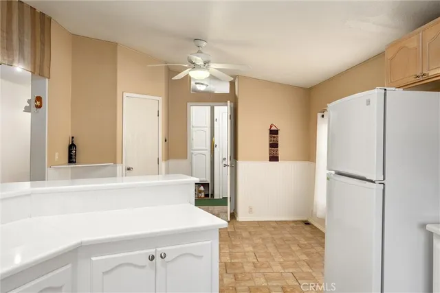 a kitchen with a refrigerator a sink and dishwasher