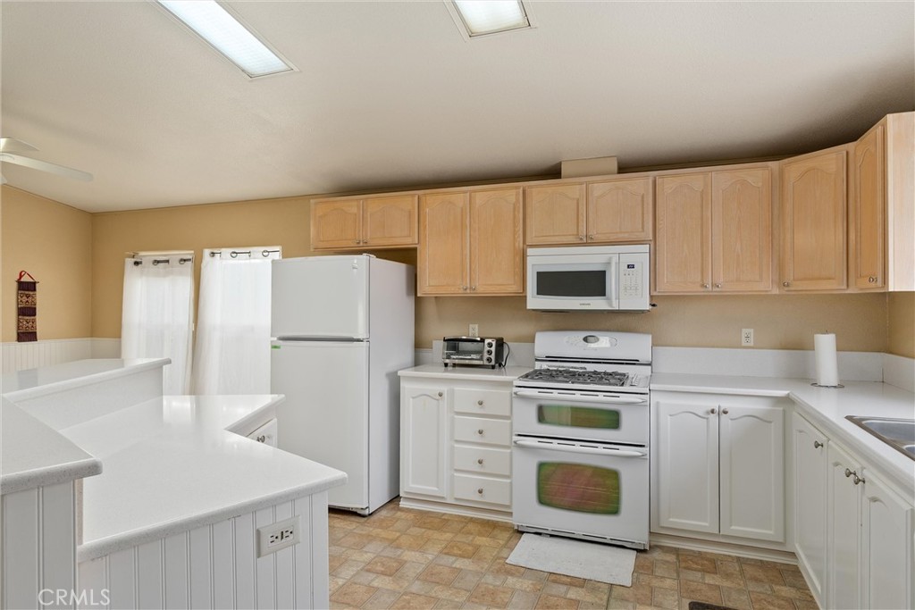 193 Railbridge Road Oroville, CA 95966 - Photo 9 of 32 a kitchen with cabinets stainless steel appliances and sink