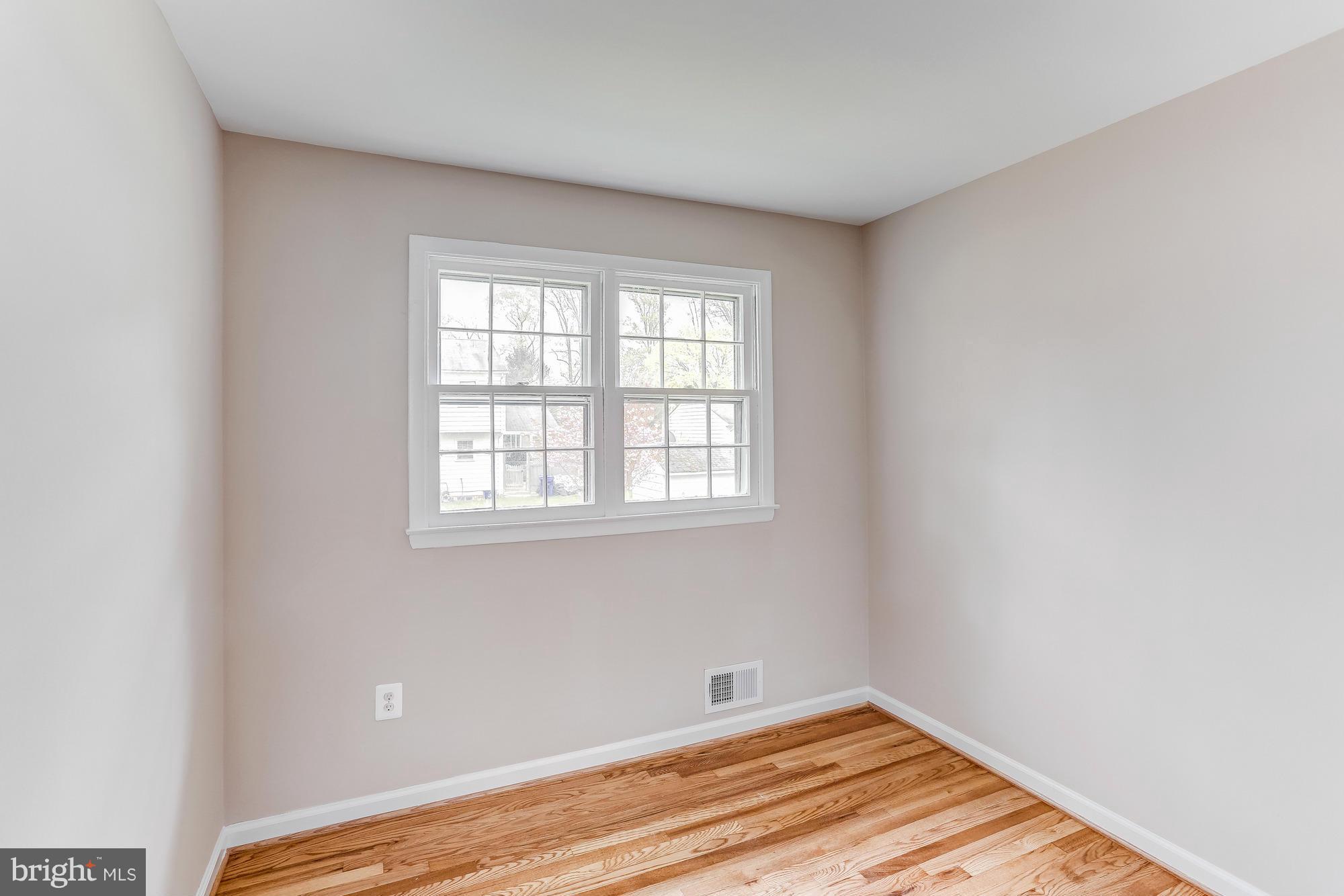 1321 Gresham Road Silver Spring, MD 20904 - Photo 13 of 30 a view of a room with wooden floor and a window
