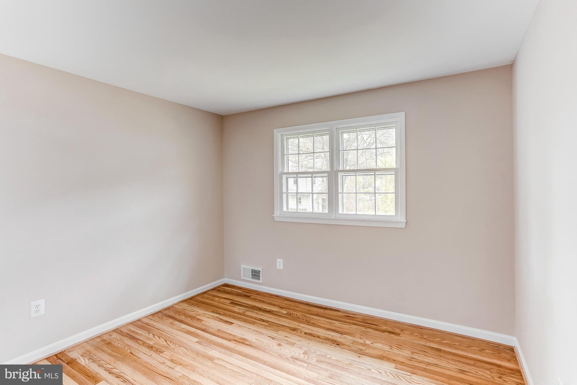 1321 Gresham Road Silver Spring, MD 20904 - Photo 14 of 30 a view of a room with wooden floor and bedroom