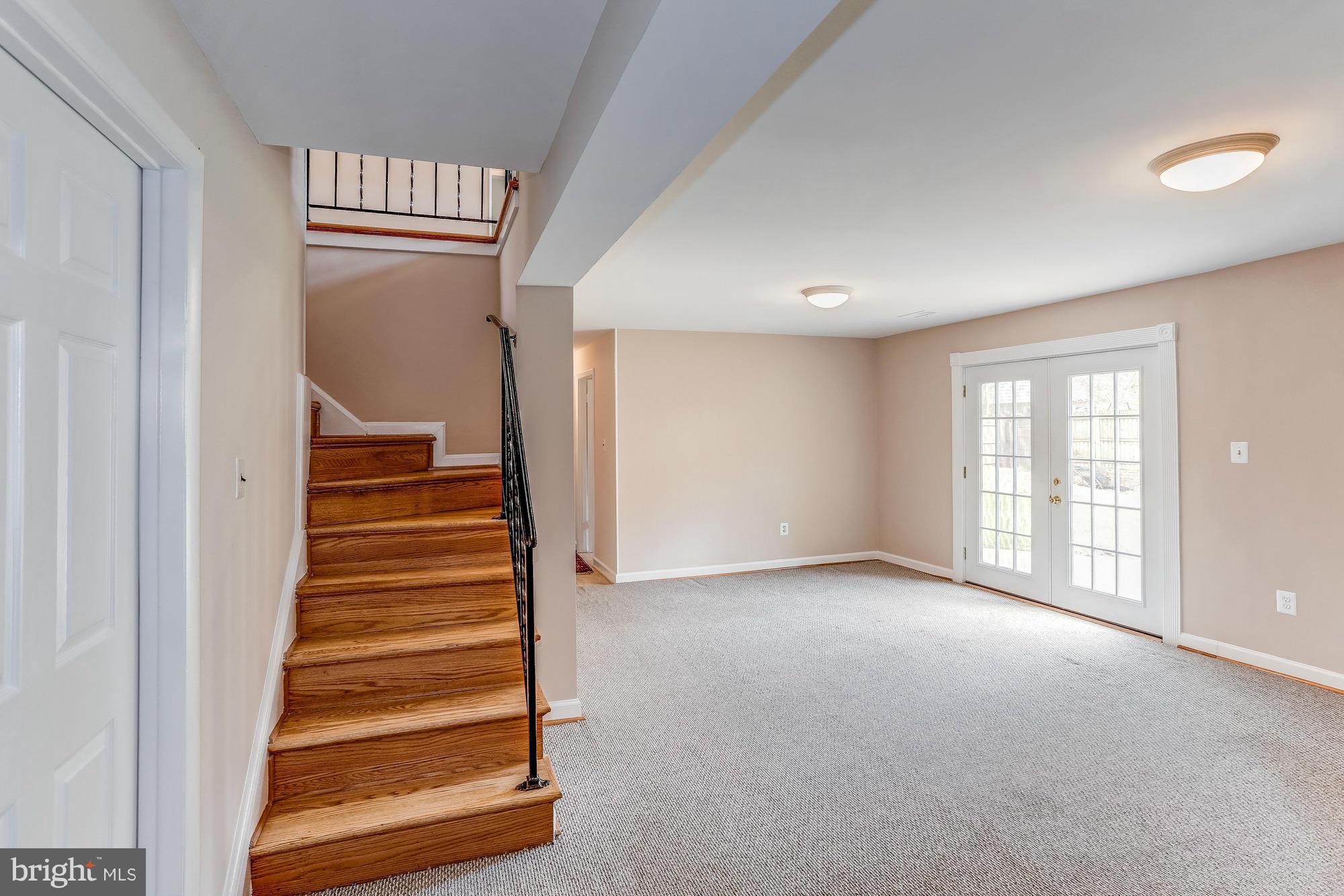 1321 Gresham Road Silver Spring, MD 20904 - Photo 19 of 30 a view of an empty room with stairs