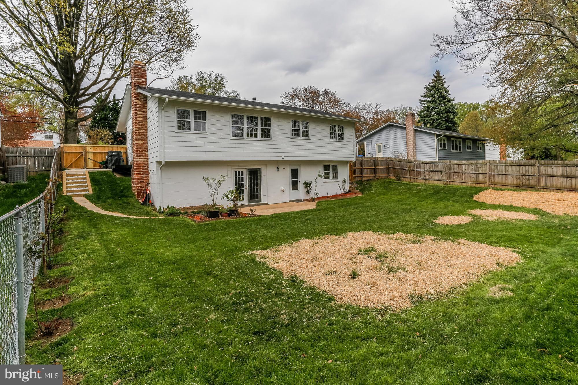 1321 Gresham Road Silver Spring, MD 20904 - Photo 27 of 30 a front view of a house with a garden and trees