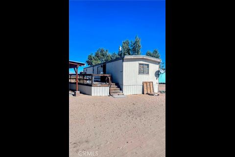 38898 Valley Center Road Daggett, CA 92327 - Photo 12 of 29 a view of a house with a patio