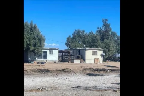 a side view of a house with a yard