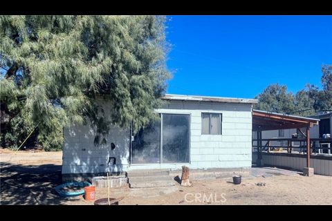 38898 Valley Center Road Daggett, CA 92327 - Photo 14 of 29 a side view of a house with a yard