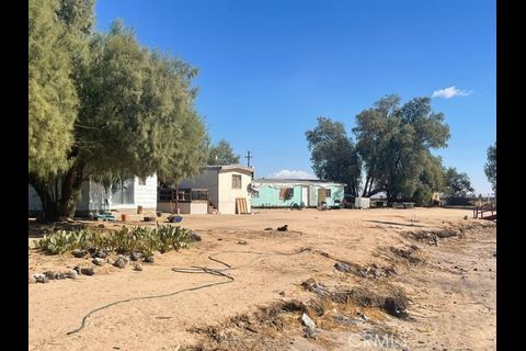 38898 Valley Center Road Daggett, CA 92327 - Photo 20 of 29 a view of a house with a snow on the road