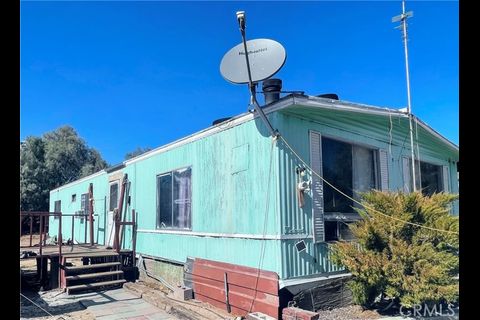 38898 Valley Center Road Daggett, CA 92327 - Photo 2 of 29 a backyard of a house with table and chairs
