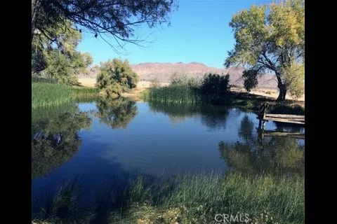 a view of lake with green space