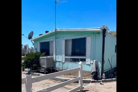 38898 Valley Center Road Daggett, CA 92327 - Photo 5 of 29 a front view of house with a potted plant