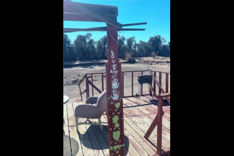 38898 Valley Center Road Daggett, CA 92327 - Photo 8 of 29 a view of an chairs and table in the balcony
