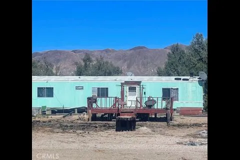 a view of a backyard of the house