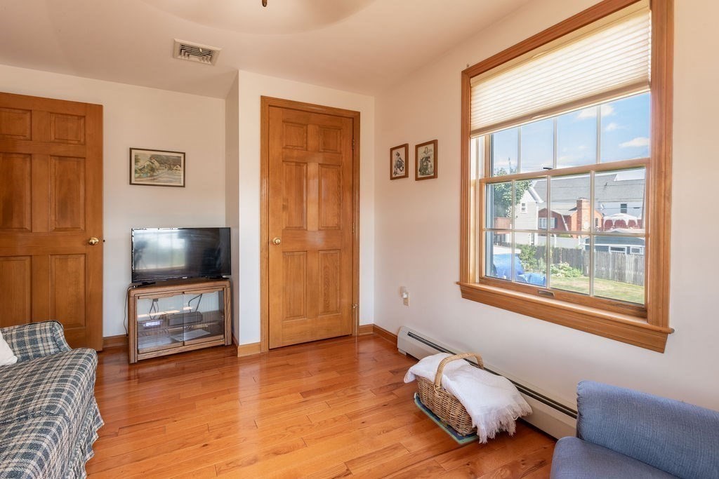 4 Clement Avenue Peabody, MA 01960 - Photo 14 of 25 a living room with furniture and a flat screen tv
