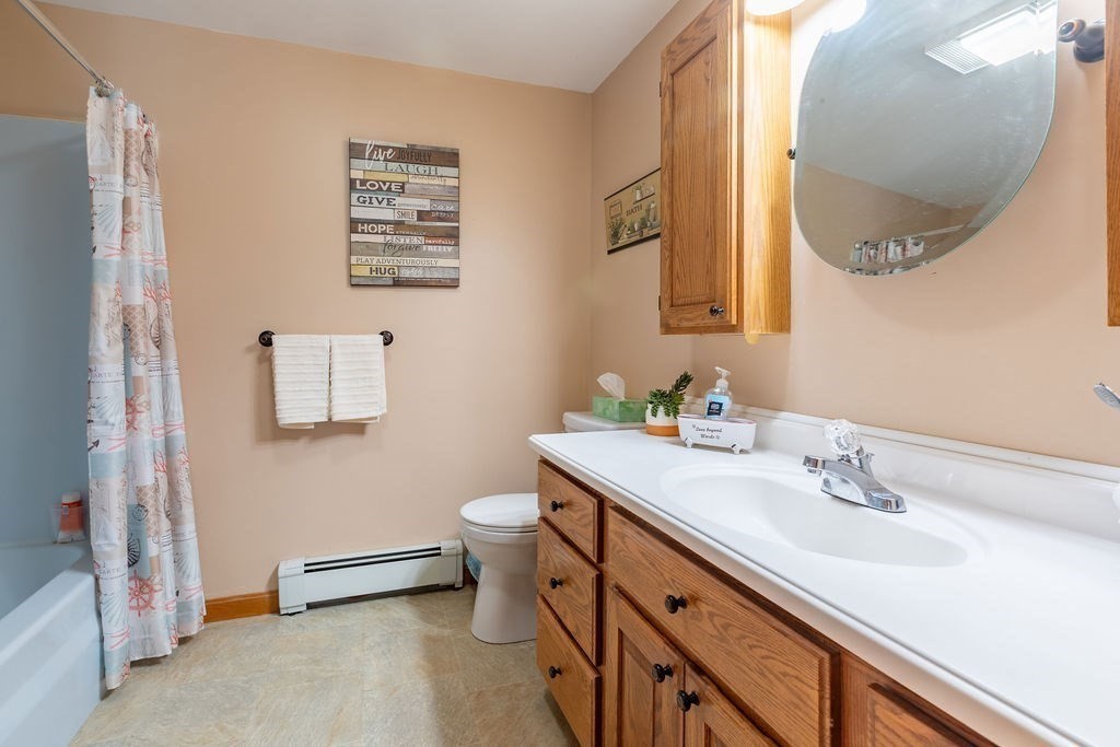 4 Clement Avenue Peabody, MA 01960 - Photo 18 of 25 a bathroom with a sink and a mirror