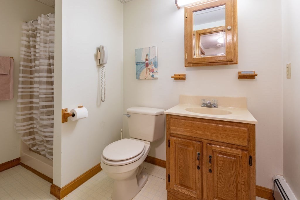 4 Clement Avenue Peabody, MA 01960 - Photo 23 of 25 a bathroom with a sink a toilet and shower