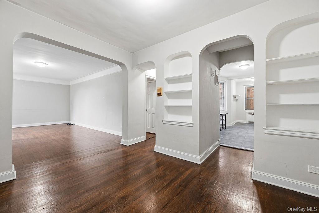 155-01 90th, Unit 3R Queens, NY 11432 - Photo 3 of 16 an empty room with wooden floor