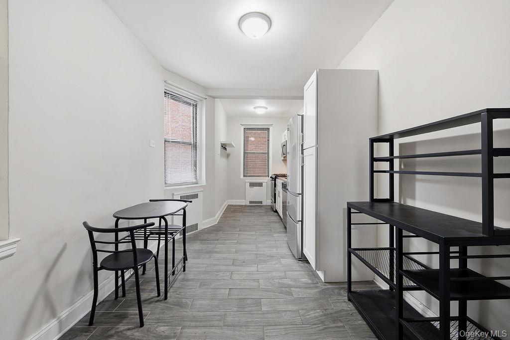 155-01 90th, Unit 3R Queens, NY 11432 - Photo 4 of 16 a view of a livingroom with furniture and hardwood floor