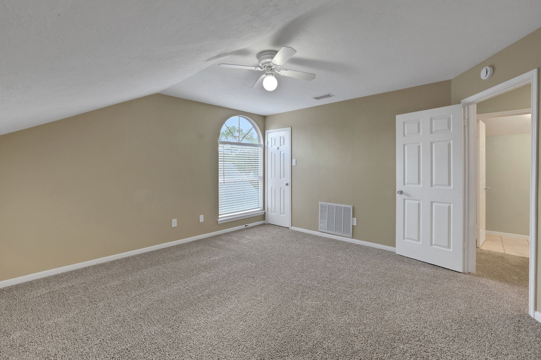 23207 Olive Ridge Court Katy, TX 77494 - Photo 28 of 46 a view of an empty room with a chandelier fan