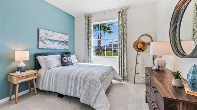 a bedroom with bed and a window