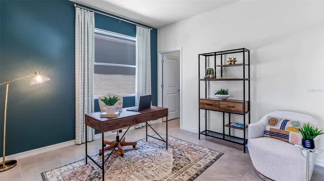 a work room with furniture and wooden floor