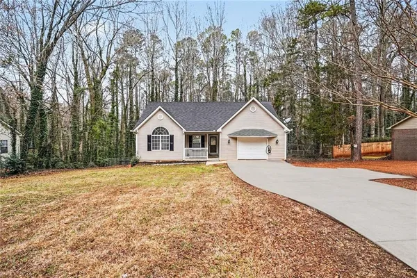 a house with a tree in front of it