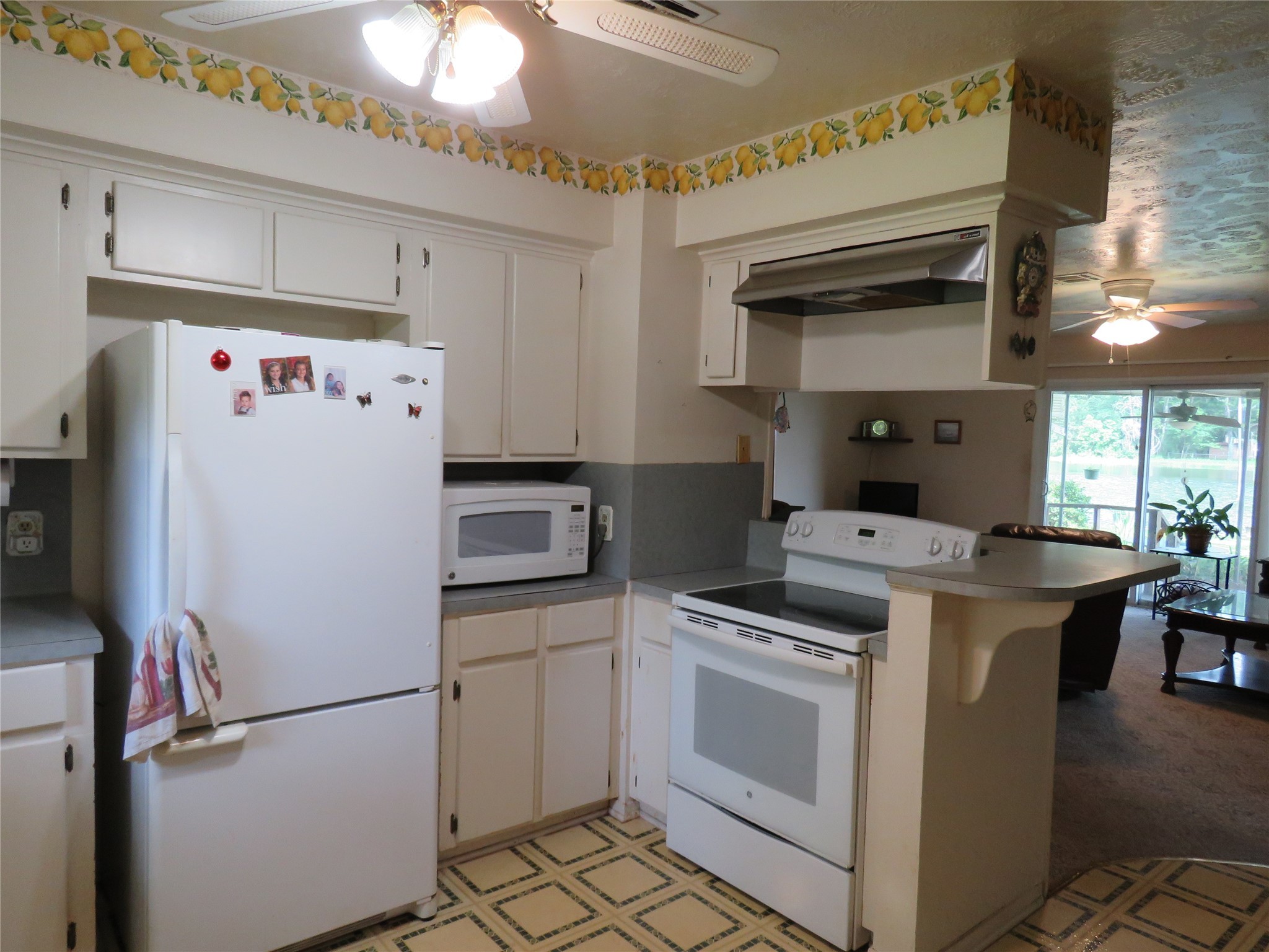 15255 Austin Road Willis, TX 77378 - Photo 13 of 25 a white refrigerator freezer sitting inside of a kitchen