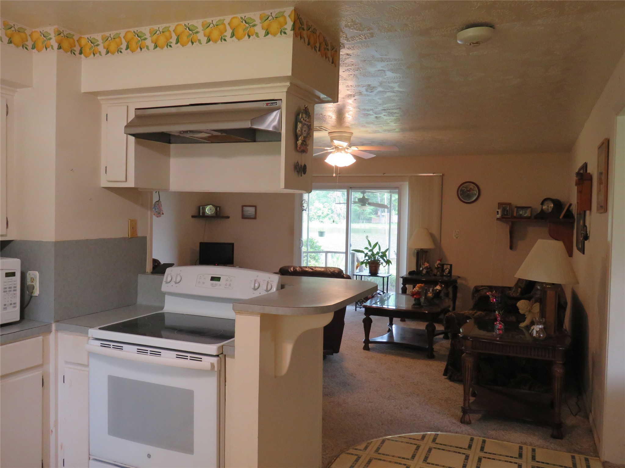 15255 Austin Road Willis, TX 77378 - Photo 14 of 25 a utility room with dryer washer and a view of living room