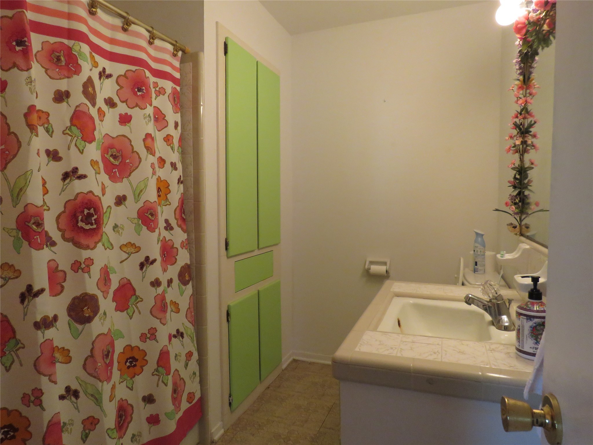 15255 Austin Road Willis, TX 77378 - Photo 19 of 25 a bathroom with a sink and mirror with bathtub