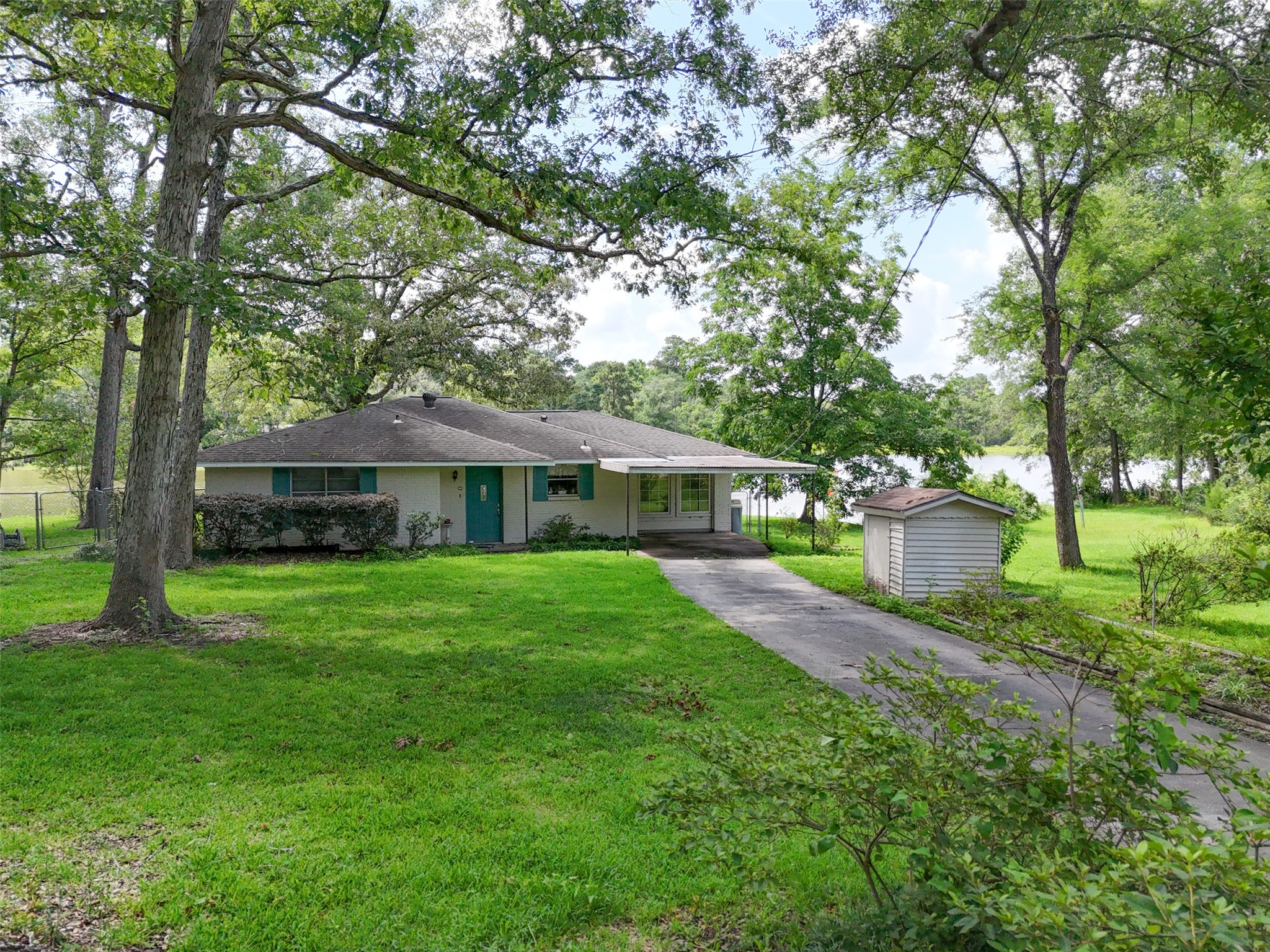 15255 Austin Road Willis, TX 77378 - Photo 20 of 25 a front view of a house with garden
