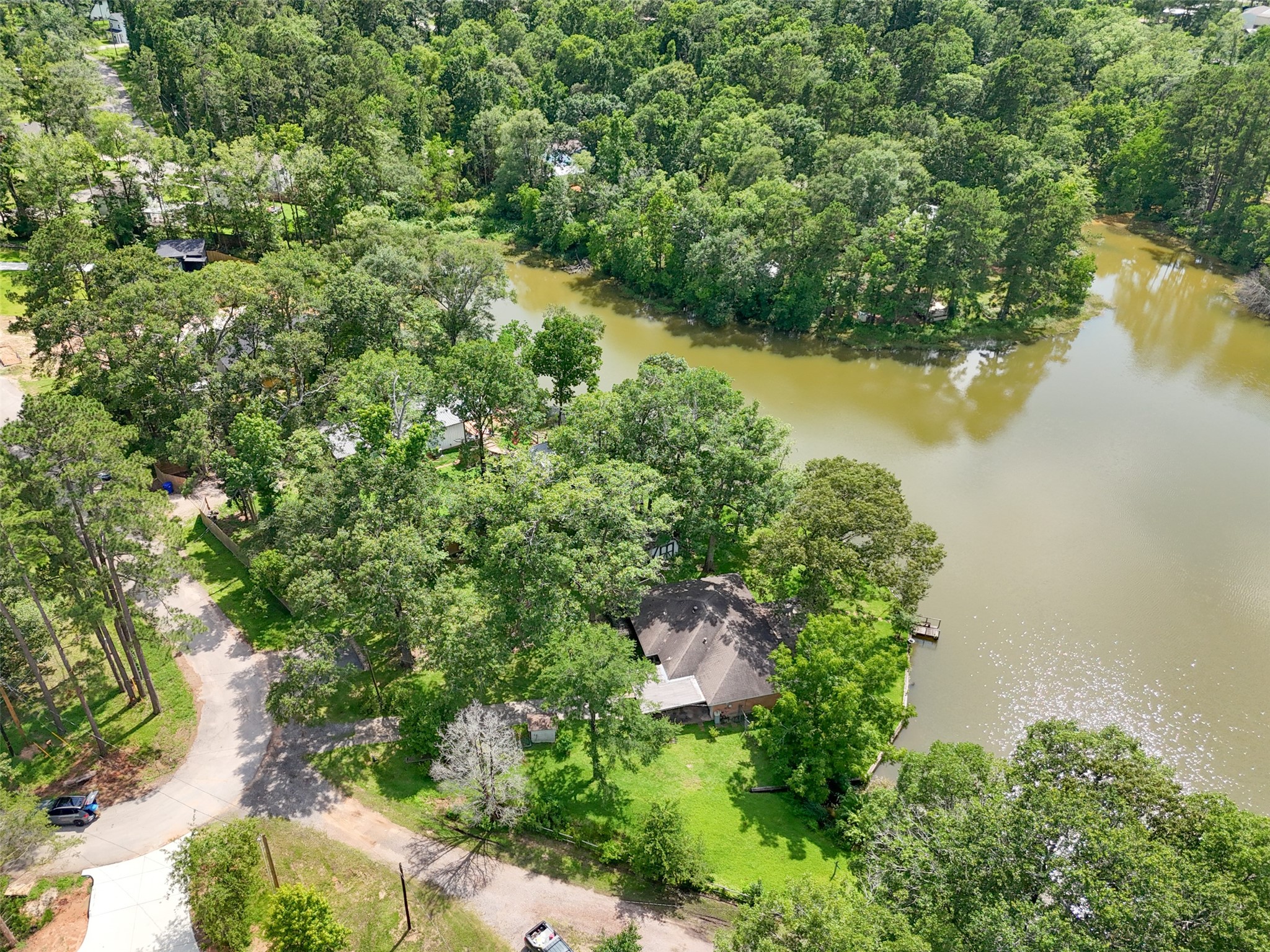 15255 Austin Road Willis, TX 77378 - Photo 23 of 25 an aerial view of a houses with outdoor space and trees all around