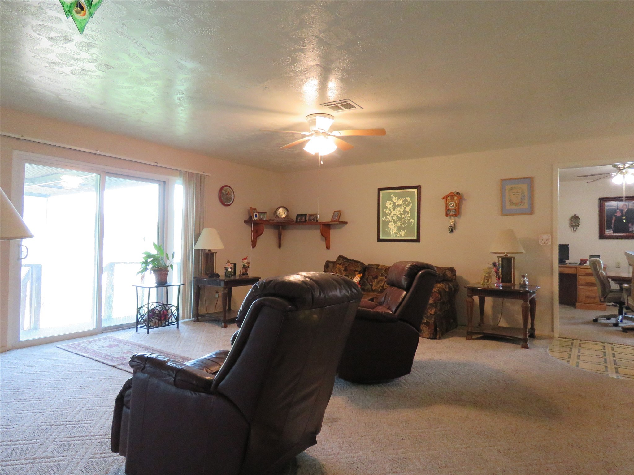 15255 Austin Road Willis, TX 77378 - Photo 9 of 25 a living room with furniture and a window