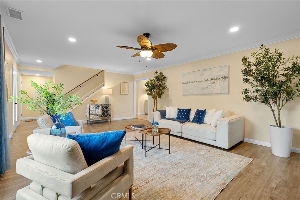 2914 South Rene Drive Santa Ana, CA 92704 - Photo 6 of 38 a living room with furniture potted plant and a chandelier