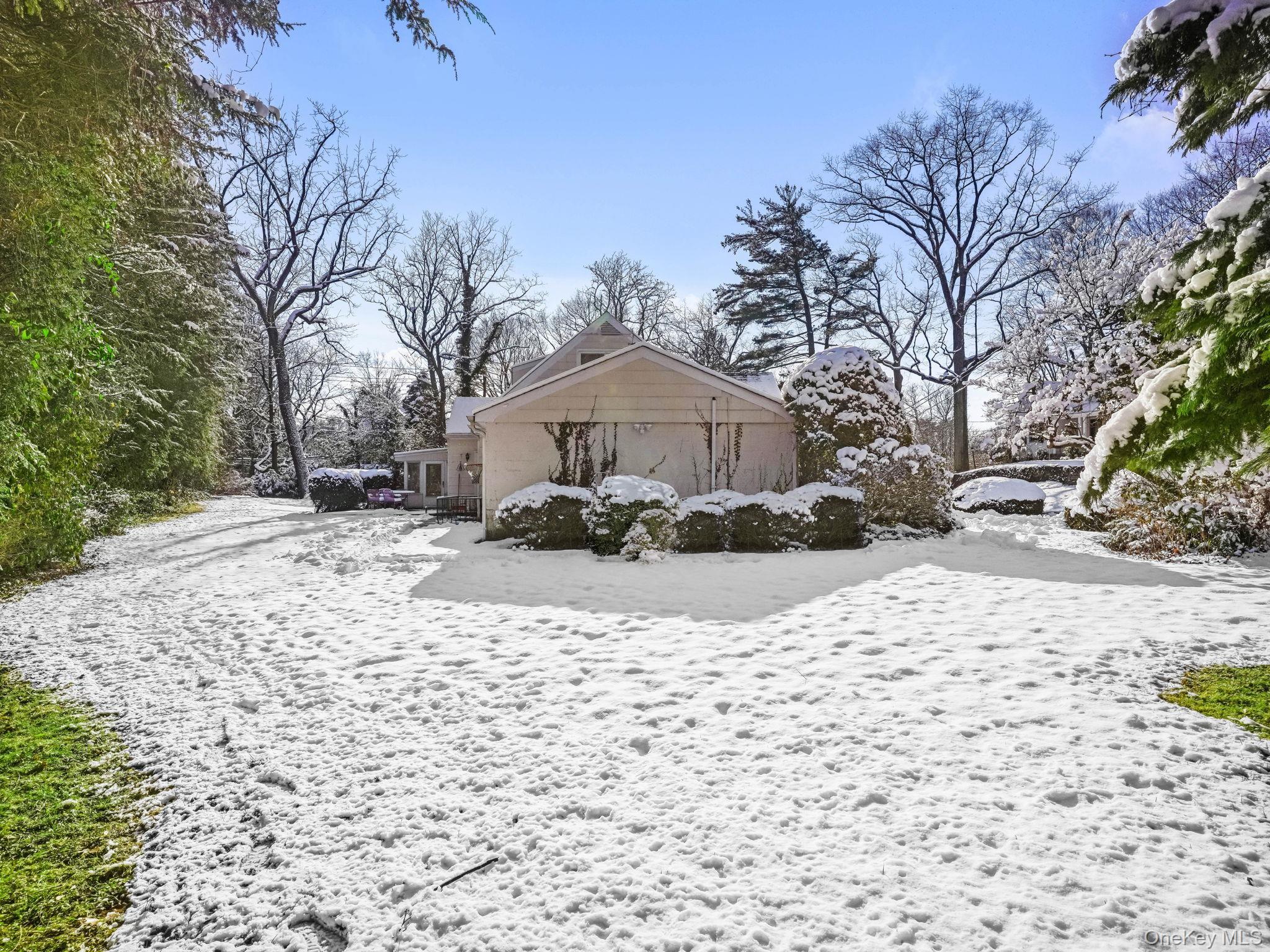 1 Village Lane Bronxville, NY 10708 - Photo 14 of 16 a street view covered with snow