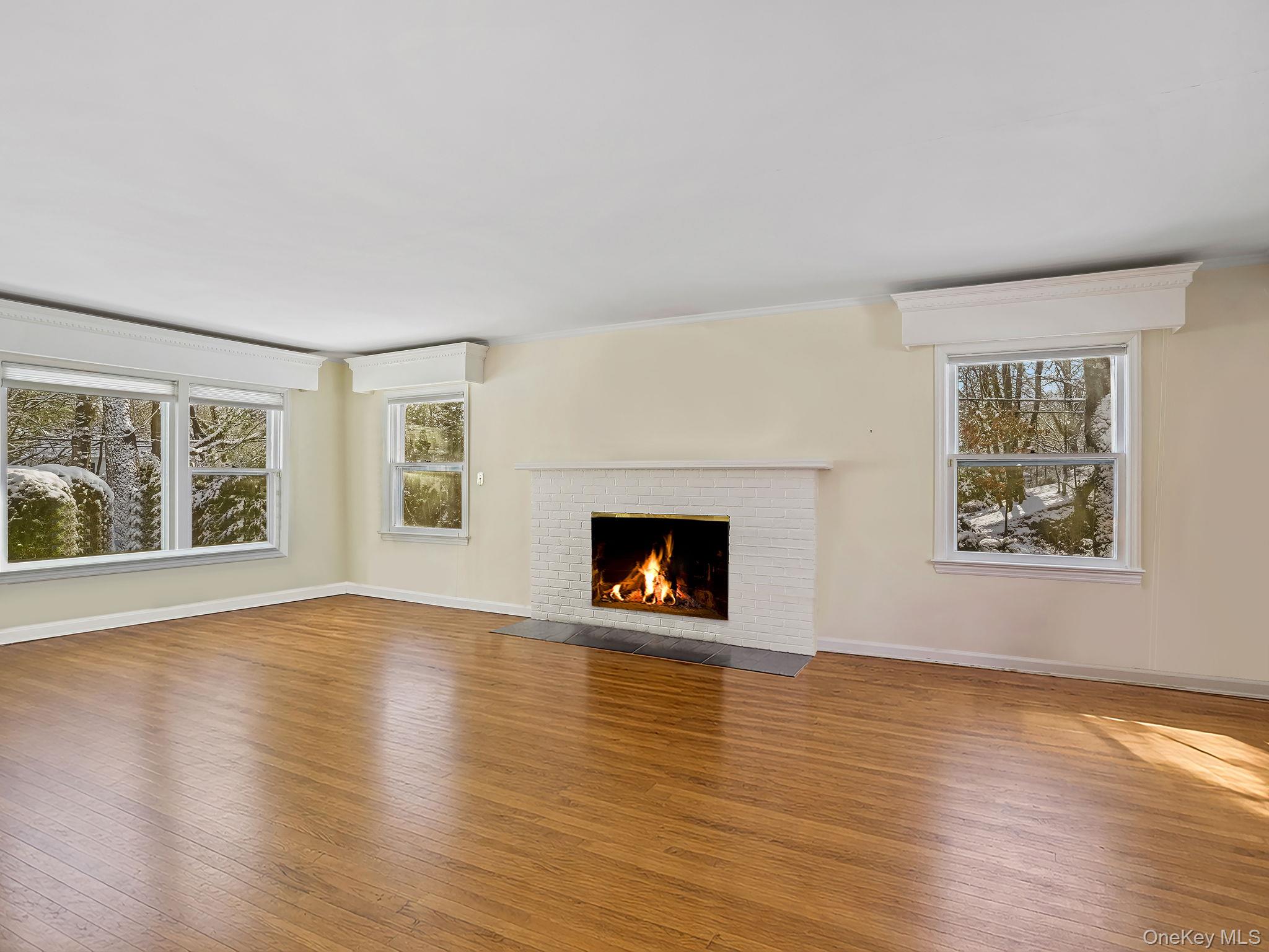 1 Village Lane Bronxville, NY 10708 - Photo 5 of 16 a view of an empty room with a window and wooden floor