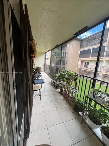 a view of front door and porch with seating space