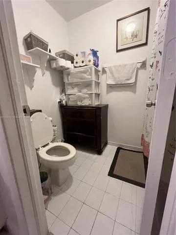 a bathroom with a toilet and a sink