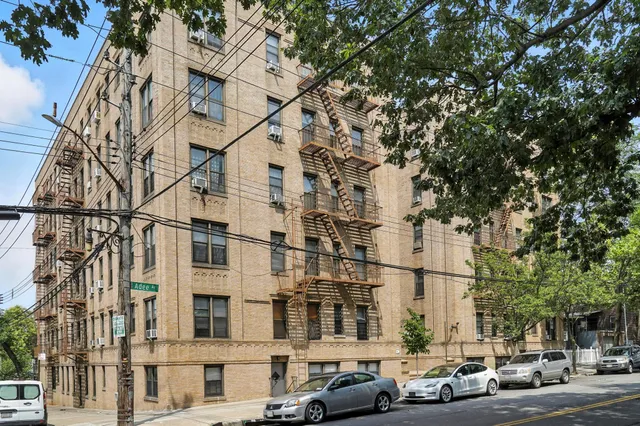 a city street lined with buildings and cars