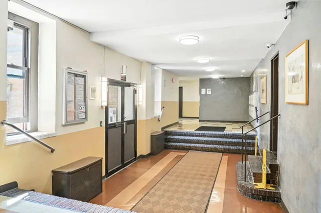 a kitchen with refrigerator and window