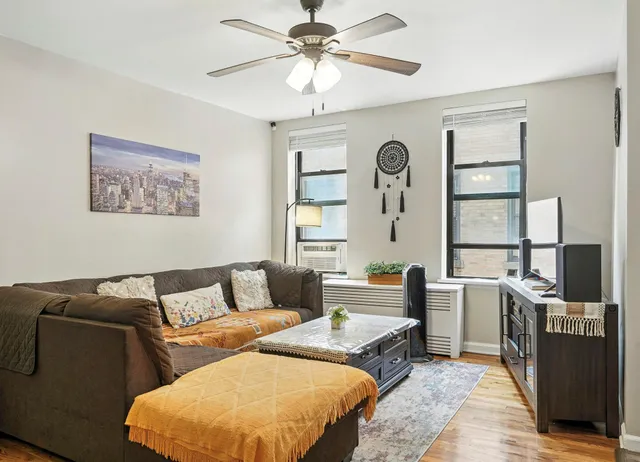 a living room with furniture and a window