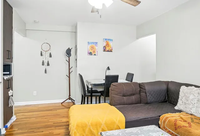 a living room with furniture and a table