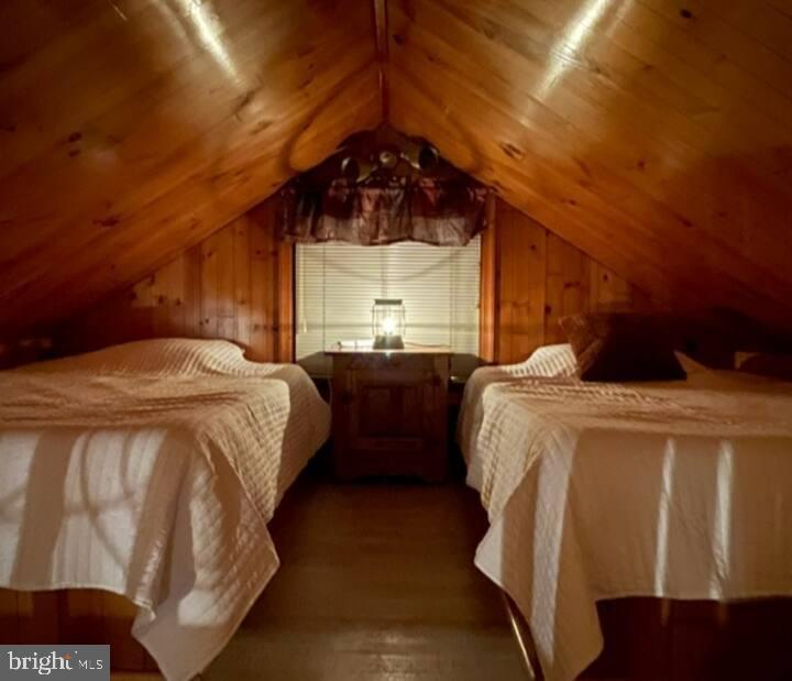 379 River Road, Unit A Elkton, MD 21921 - Photo 15 of 20 a bedroom with two beds and a dresser with wooden floor