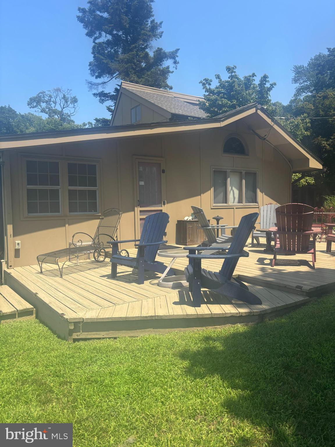 379 River Road, Unit A Elkton, MD 21921 - Photo 16 of 20 a view of a house with backyard sitting area and garden